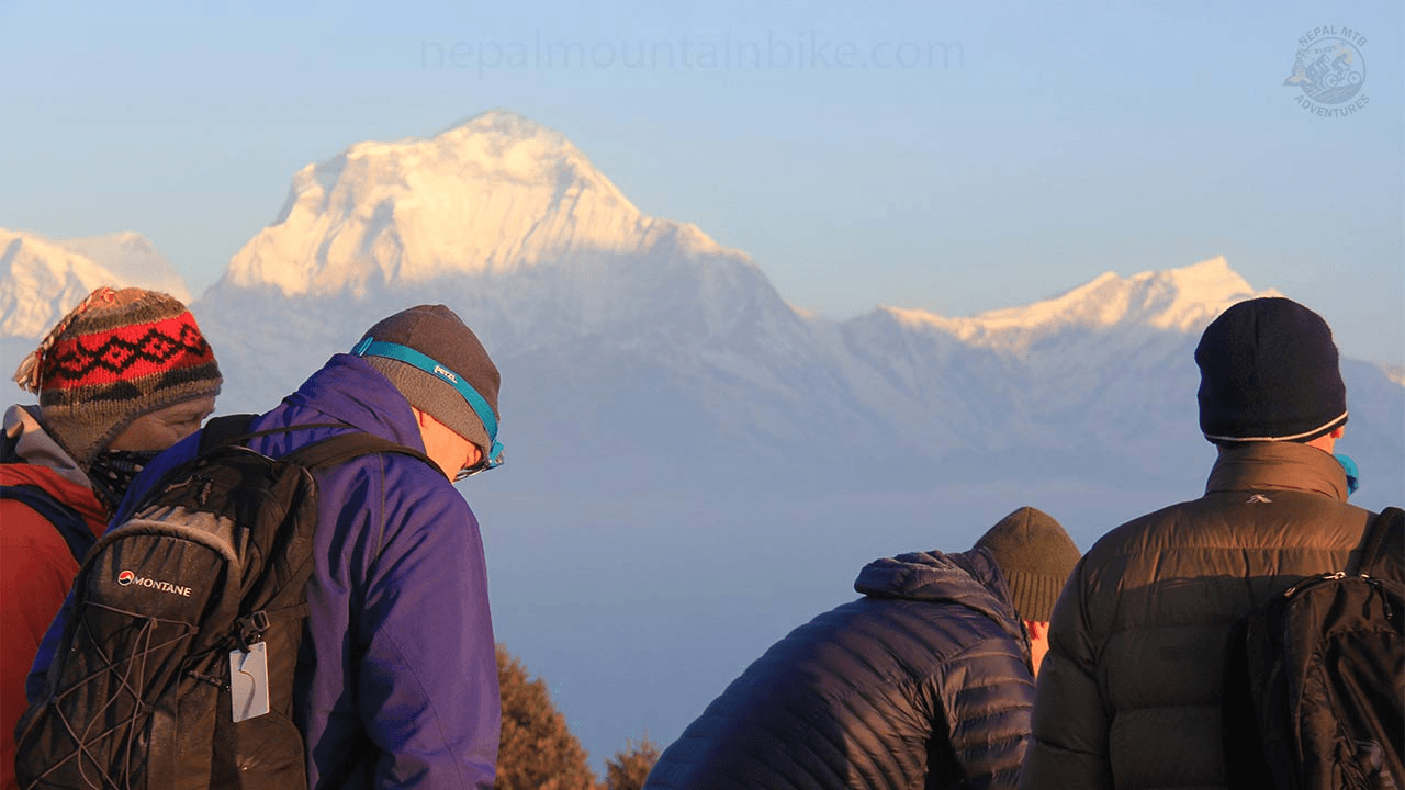 Riders looking toward a Himalayan mountain