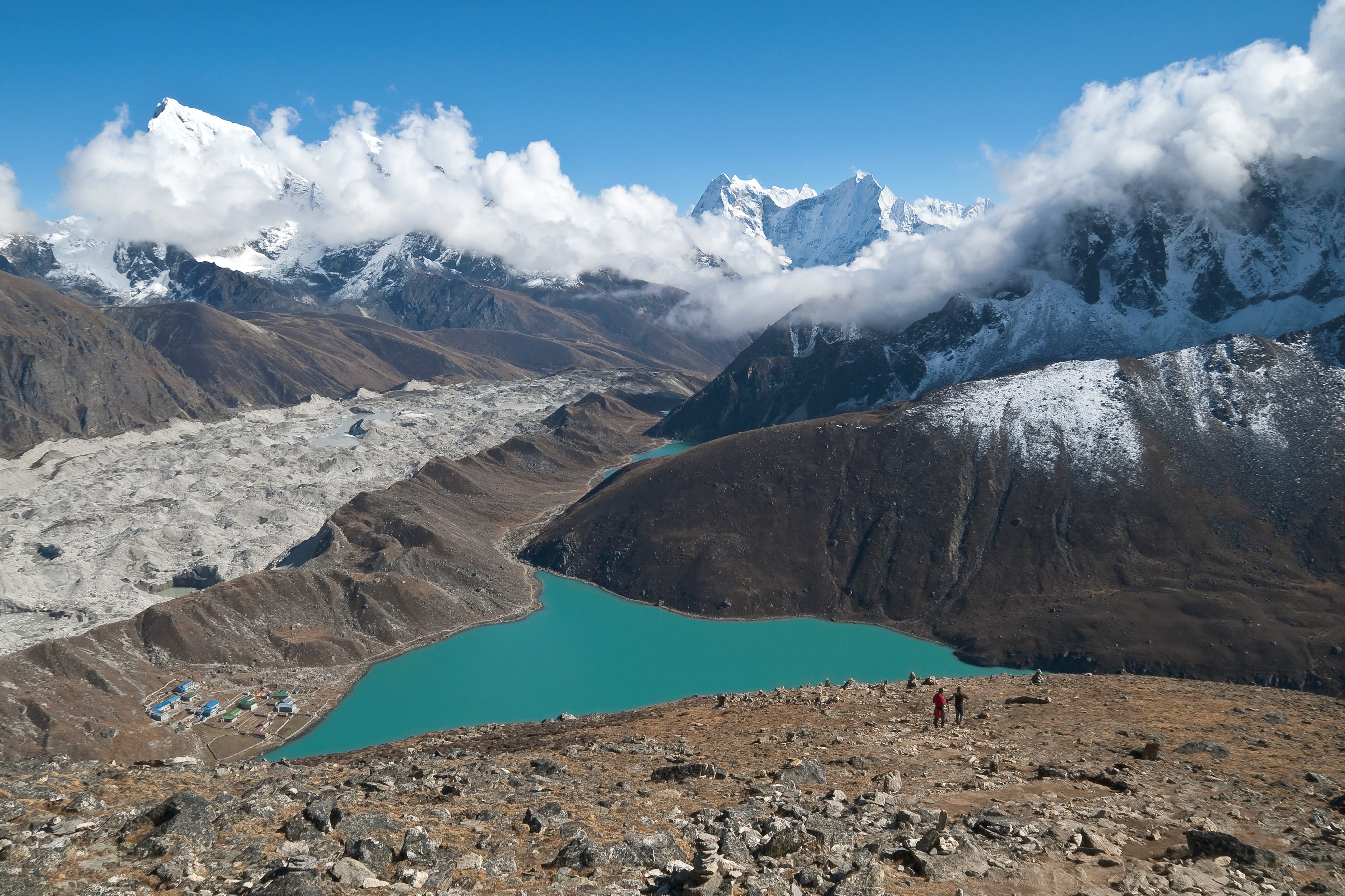 Snowy Himalayan landscape and turquoise lake