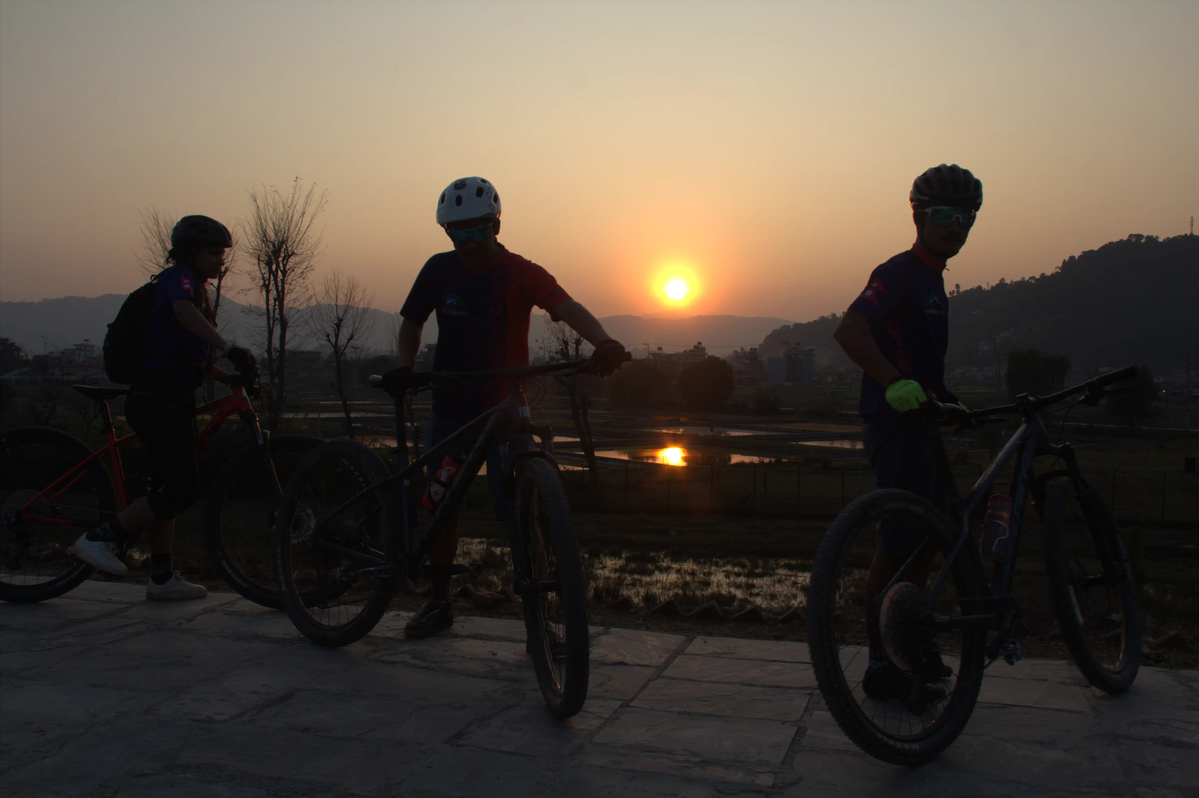 mtbriderssilhouettesunset.webp