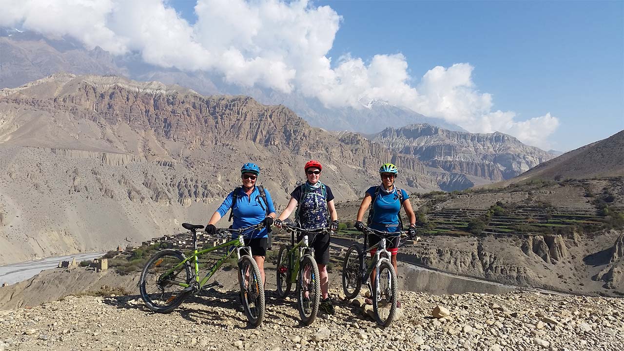 Three western women enjoying their ride in the Mustang region