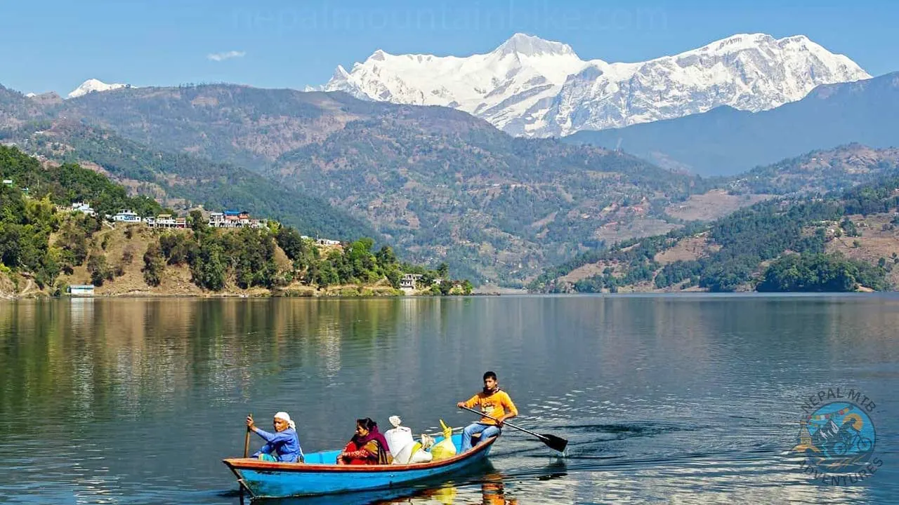 People are rowing the boat across Phewa Lake during the transportation of the food supplies in Pokhara, Nepal.