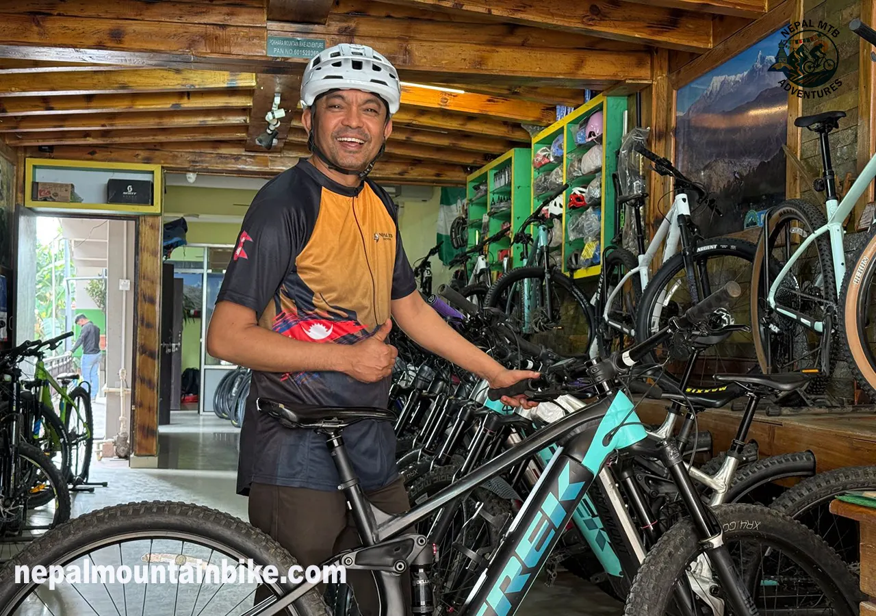 Jagan Biswakarma with E-MTB rental fleet in Pokhara Nepal 2026