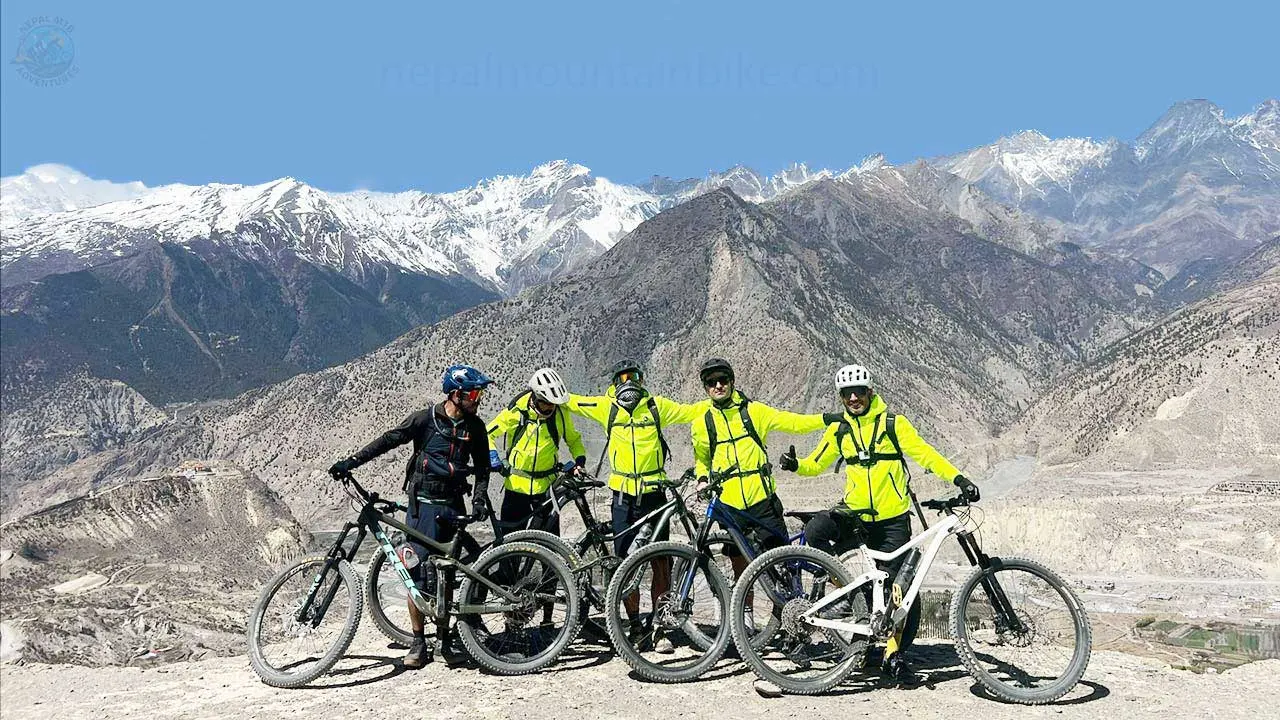 Mountain bikers are ready to click a picture during their mountain bike trip around the Annapurna.