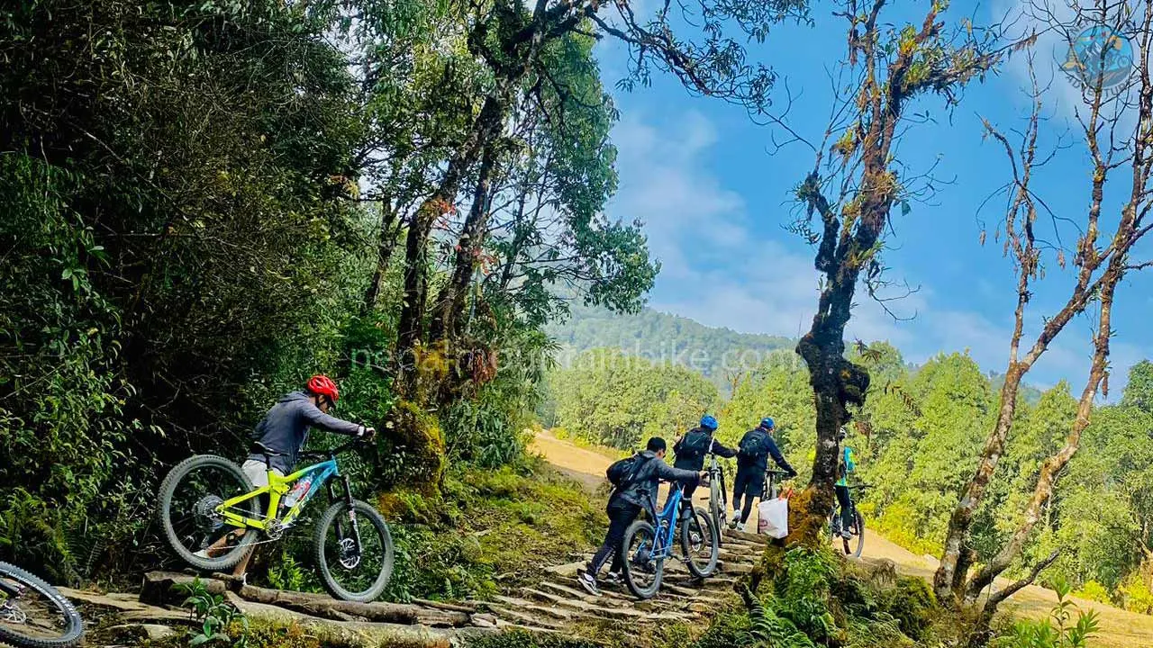 Mountain bikers are pushing bikes during the MTB tour in Australian Camp, Pokhara.