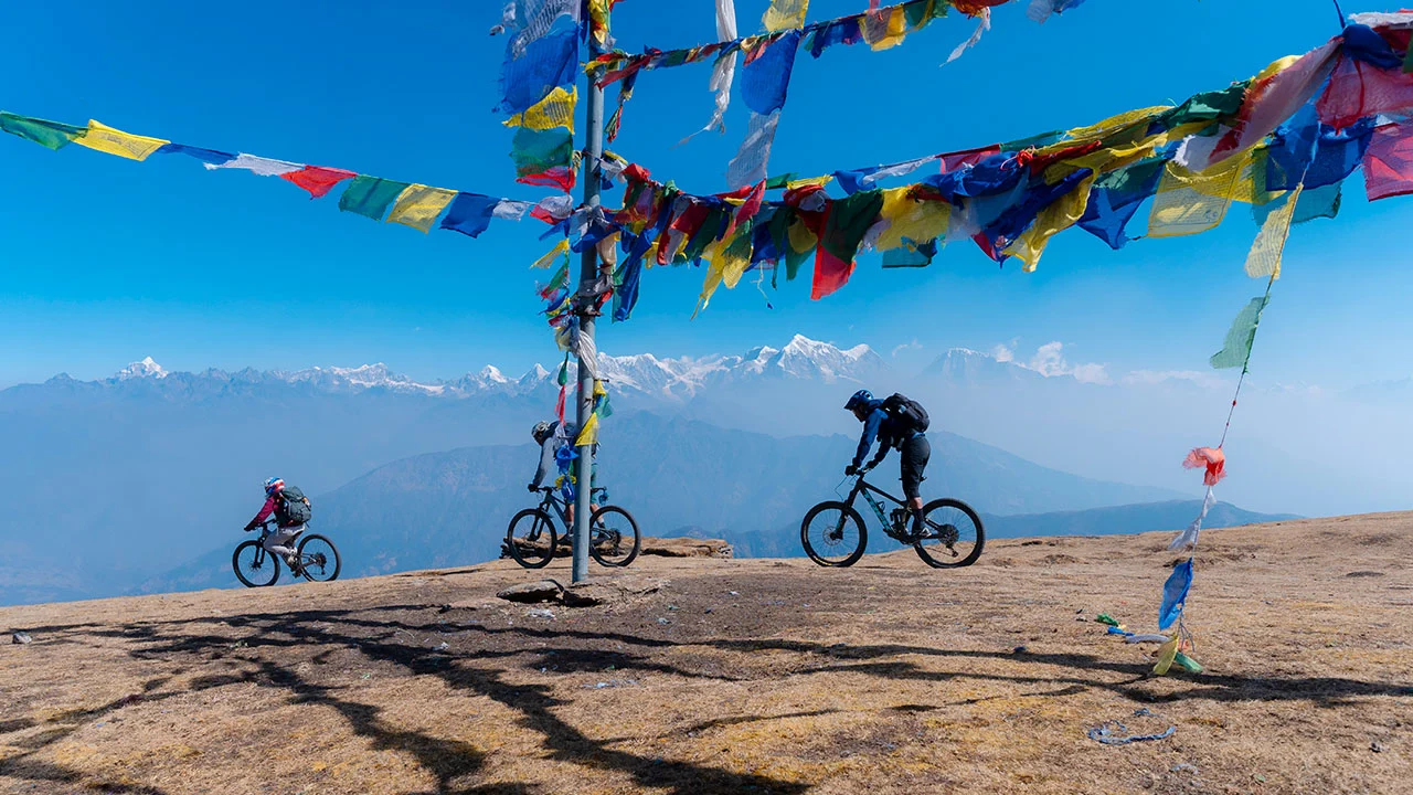 Mountain bikers enjoying their scenic ride at Pikey Peak in the Everest region during the tour in the Himalayas of Nepal.